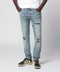 AMIRI MX1 distressed flannel-patched jeans in medium indigo