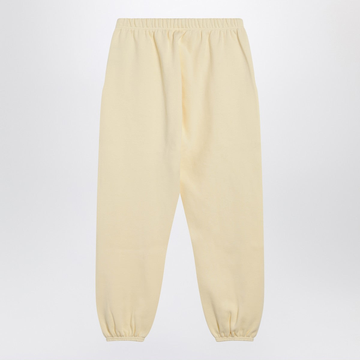 Fear of God Essentials Yellow jogging pants with logo