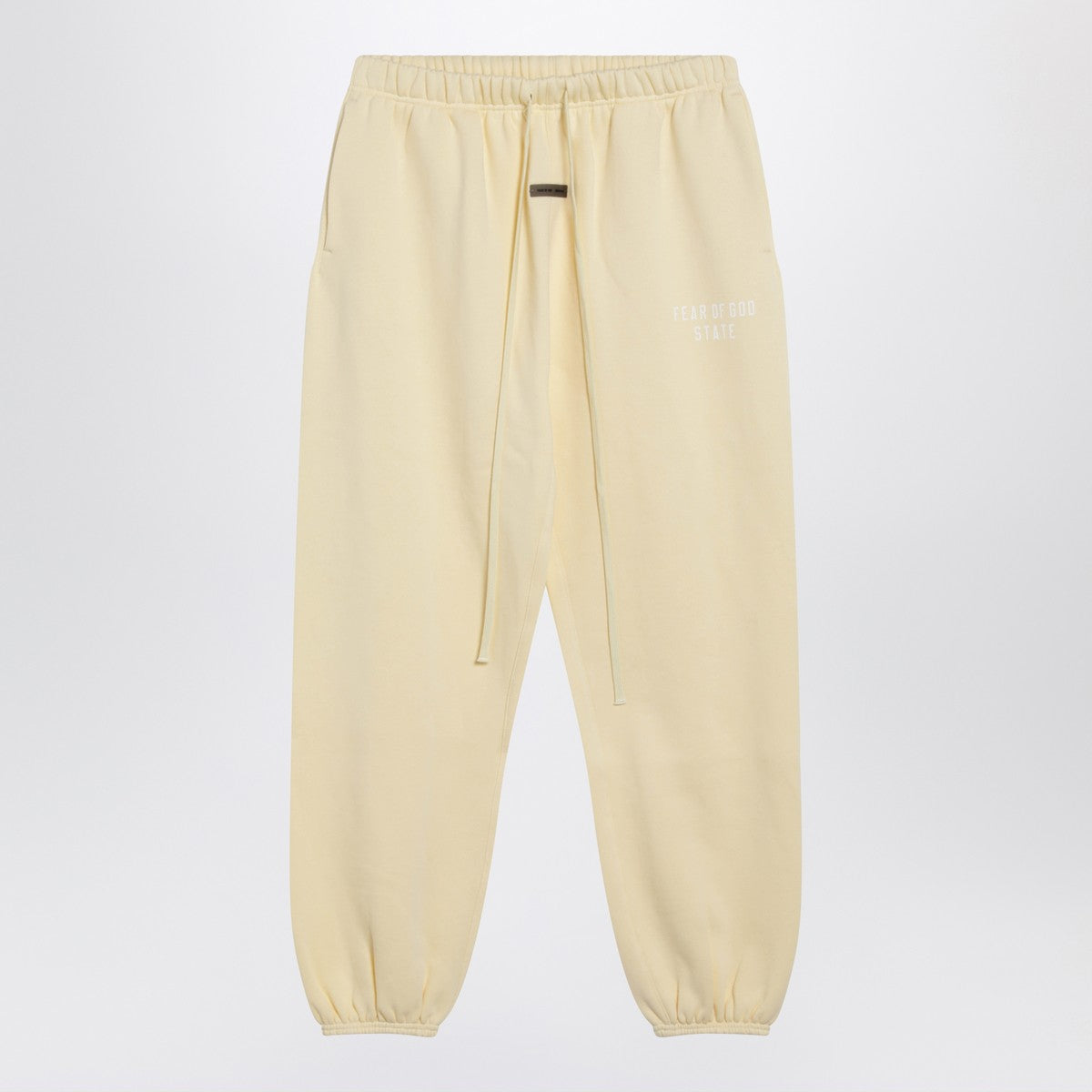 Fear of God Essentials Yellow jogging pants with logo