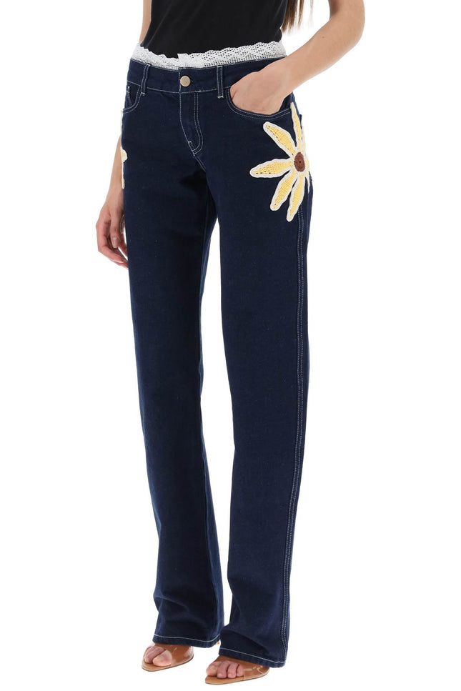 low-rise jeans with crochet flowers