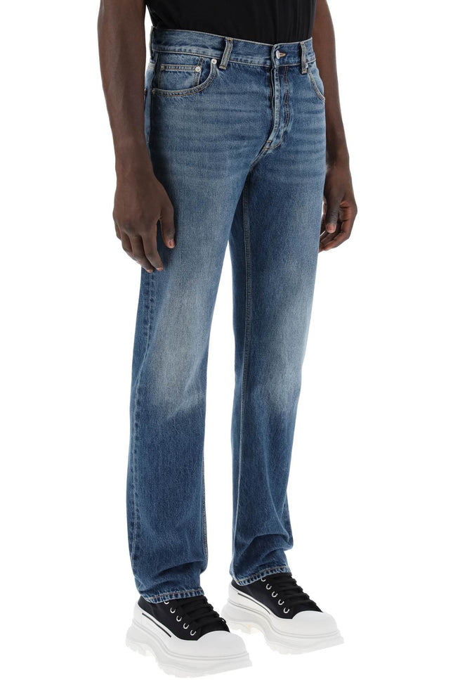 straight leg jeans with faux pocket on the back.
