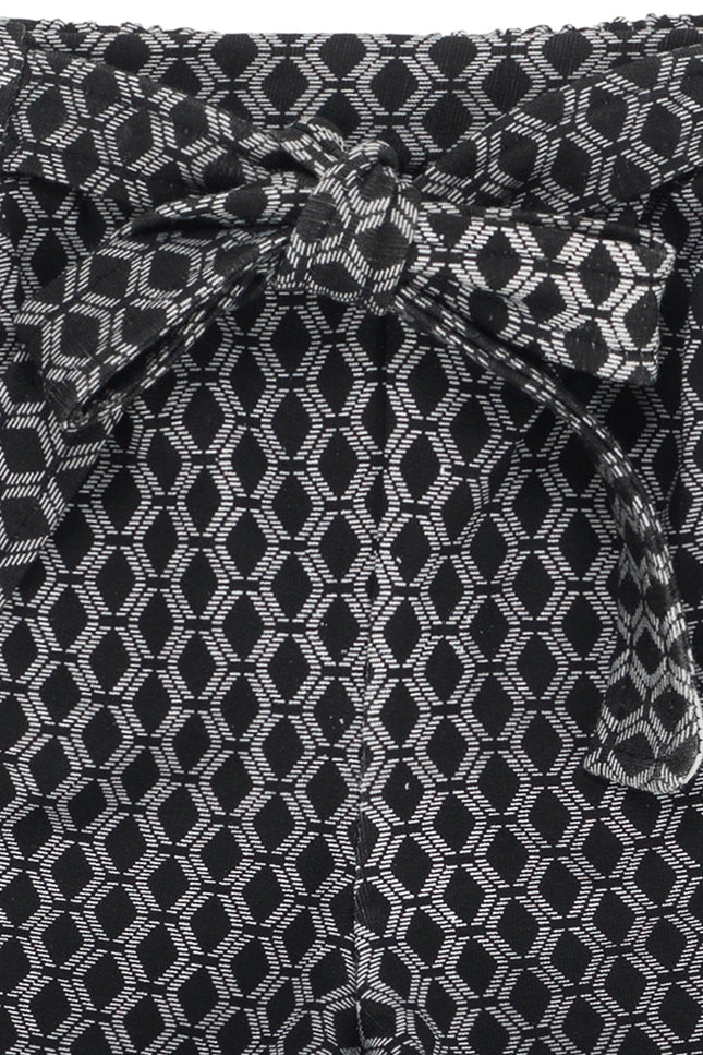 Girl'S Shorts In Black And Ecru Printed Elastic Fleece.